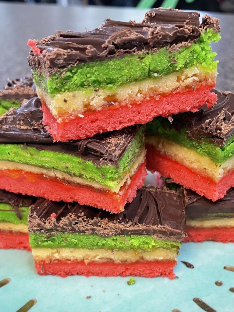 a stack of rainbow cookies